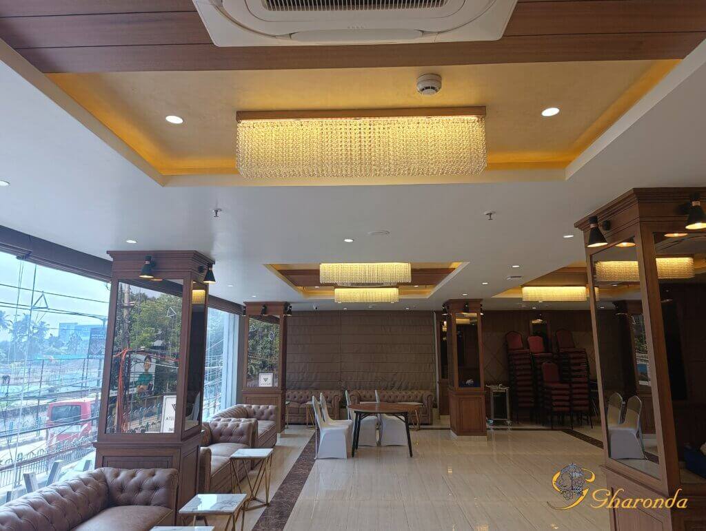 Lobby false ceiling with warm chandelier lighting