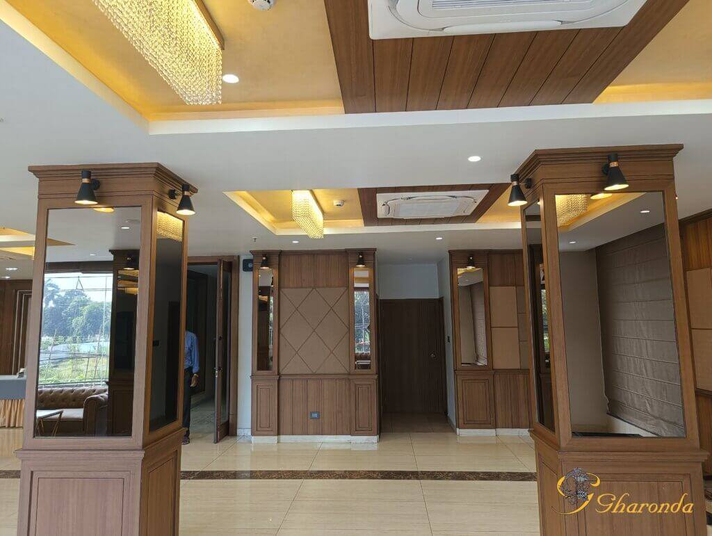 Reception false ceiling with layered lighting