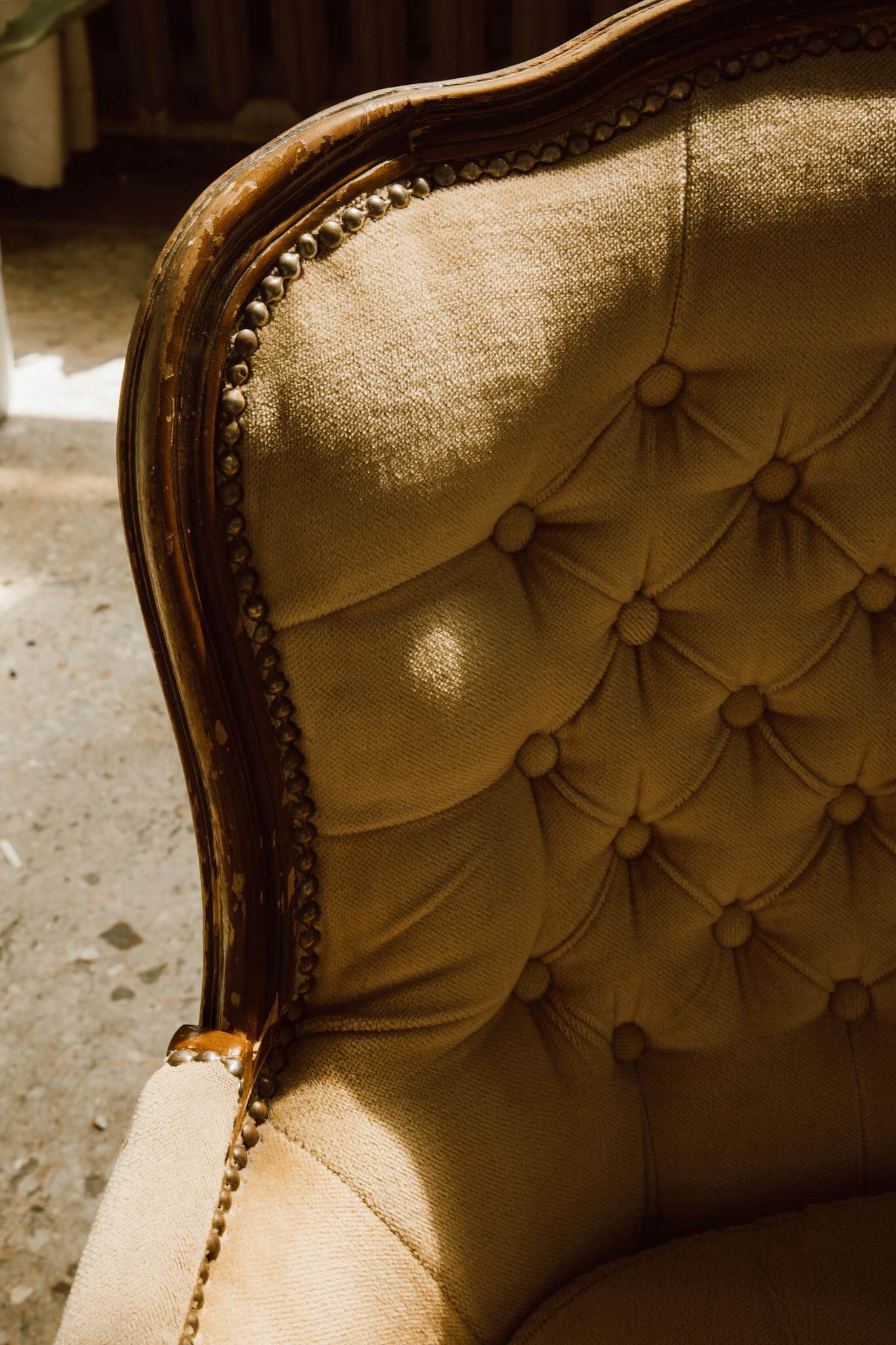 close up of a vintage upholstered armchair in