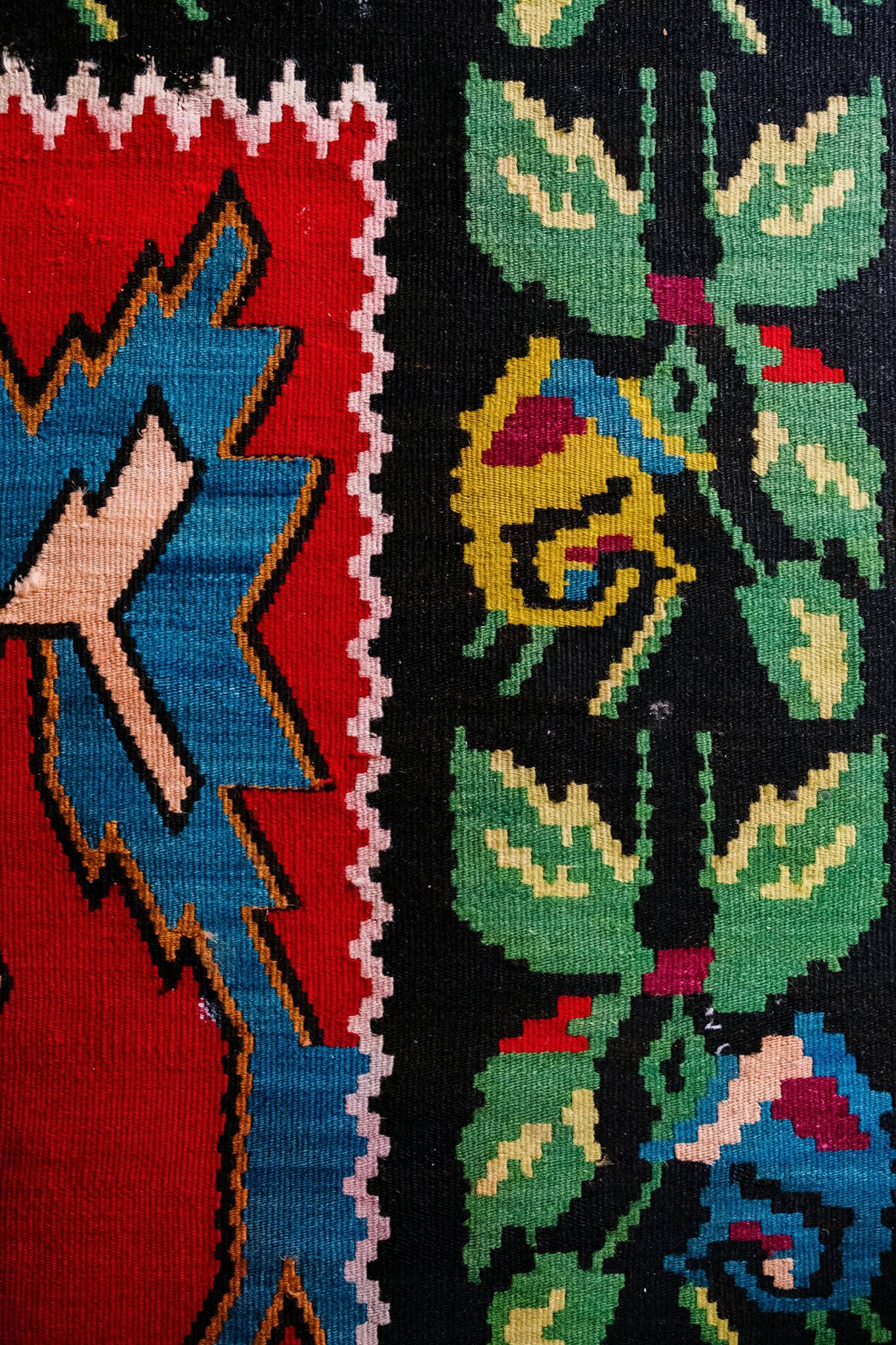 vibrant red and green patterned textile showcasing